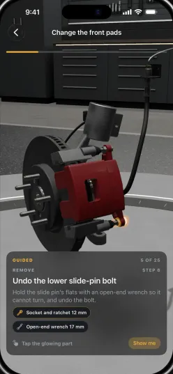 A guided brake pad change in 3D Mechanic, with the current bolt highlighted and the socket and ratchet shown below